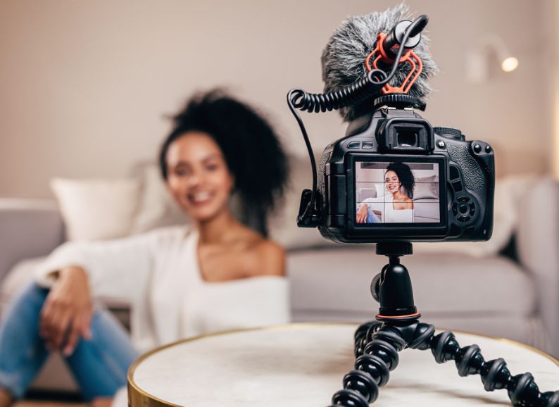 Female shooting a video for social media