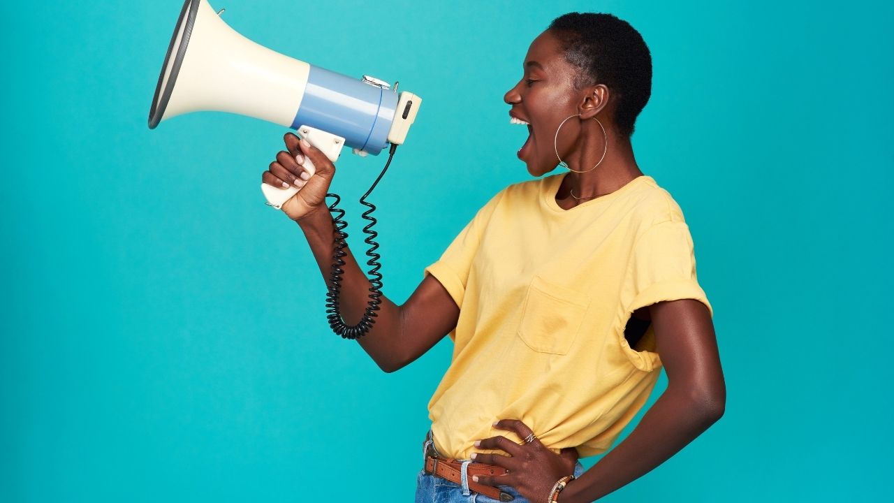 Promote yourself as a podcast guest, black woman using a megaphone. 